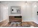 Bright entryway featuring a wooden console table, decorative mirror, and hardwood floors, for a welcoming atmosphere at 7234 Fairwood Dr, Indianapolis, IN 46256