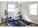 Exercise room featuring weight training equipment with two windows and plenty of natural light at 7234 Fairwood Dr, Indianapolis, IN 46256