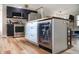 Open concept kitchen with stainless steel appliances, island with beverage cooler, and wooden countertops at 7234 Fairwood Dr, Indianapolis, IN 46256