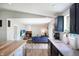 Open concept with kitchen island connected to living room with fireplace and entertainment center at 7234 Fairwood Dr, Indianapolis, IN 46256