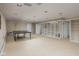 Spacious finished basement area with recessed lighting, open shelving, and a ping pong table at 7401 N Layman Ave, Indianapolis, IN 46250