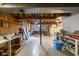 Unfinished basement storage area with exposed beams and a concrete floor at 7401 N Layman Ave, Indianapolis, IN 46250