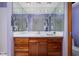 Bathroom featuring a spacious vanity and a well-lit mirror for a modern look at 7401 N Layman Ave, Indianapolis, IN 46250