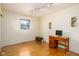 Bright bedroom with a desk area, hardwood floors, and a comfortable atmosphere at 7401 N Layman Ave, Indianapolis, IN 46250