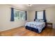 Cozy bedroom with hardwood floors and great natural light from the windows at 7401 N Layman Ave, Indianapolis, IN 46250