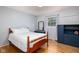 Charming bedroom with hardwood floors, soft light, and ample storage at 7401 N Layman Ave, Indianapolis, IN 46250