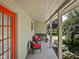 Charming covered patio perfect for outdoor lounging with comfortable seating and lush greenery at 7401 N Layman Ave, Indianapolis, IN 46250
