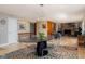 Open-concept dining area seamlessly connects to the living room, perfect for entertaining at 7401 N Layman Ave, Indianapolis, IN 46250