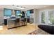 Modern kitchen featuring sleek cabinetry, stainless steel appliances, and a convenient breakfast bar at 7401 N Layman Ave, Indianapolis, IN 46250