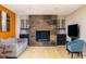 Inviting living room with a stone fireplace and stylish furnishings for relaxation at 7401 N Layman Ave, Indianapolis, IN 46250