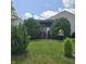 Private backyard with lush landscaping, mature trees, and outdoor space at 7608 Mather Ln, Indianapolis, IN 46239
