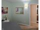 Comfortable bedroom featuring a mirror, art and access to the ensuite bathroom at 7608 Mather Ln, Indianapolis, IN 46239