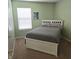 Bedroom featuring a comfortable bed and a bright window for natural light at 7608 Mather Ln, Indianapolis, IN 46239
