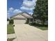 Charming home with a two-car garage, front porch, and well-maintained landscaping at 7608 Mather Ln, Indianapolis, IN 46239