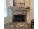 Close-up of a charming fireplace with a tiled surround and decorative mantel at 7608 Mather Ln, Indianapolis, IN 46239