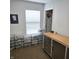 Hobby room with a rolling work bench and lots of plastic storage bins for hobby supplies at 7608 Mather Ln, Indianapolis, IN 46239