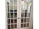 Stylish home office features a glass door entry and ceiling fan at 7608 Mather Ln, Indianapolis, IN 46239