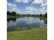 Community pond with lush landscaping and neighborhood homes at 7608 Mather Ln, Indianapolis, IN 46239