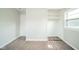 This carpeted bedroom has a closet and window at 8210 Patton Dr, Lawrence, IN 46226