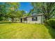 Charming single-story home with mature trees, providing a serene and welcoming curb appeal at 8210 Patton Dr, Lawrence, IN 46226