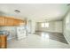 Kitchen with vintage-style cabinets, updated flooring, and a view into another room at 8210 Patton Dr, Lawrence, IN 46226