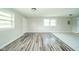Open-concept space with gray floors, neutral walls, and doorways to other rooms at 8210 Patton Dr, Lawrence, IN 46226