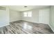 Spacious living area featuring gray-toned flooring, fresh paint, and a welcoming entrance at 8210 Patton Dr, Lawrence, IN 46226