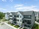 Charming community showcasing well-manicured lawns, townhomes, and inviting balconies in a tranquil setting at 830 Freeland Way, Carmel, IN 46032
