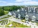 Well-planned community featuring modern townhomes, lush landscaping, and convenient parking in a suburban setting at 830 Freeland Way, Carmel, IN 46032