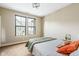 Bedroom with two windows, neutral carpet, a comfortable bed with patterned bedding at 830 Freeland Way, Carmel, IN 46032