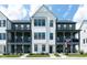 Charming new construction townhome features classic design, black windows, and inviting curb appeal at 830 Freeland Way, Carmel, IN 46032