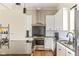 Modern kitchen features stainless appliances, a subway tile backsplash, and a barstool seating area at 830 Freeland Way, Carmel, IN 46032
