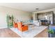 Open-concept living room flows to the kitchen, with two chairs, and a comfortable sofa at 830 Freeland Way, Carmel, IN 46032