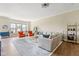 Spacious living room with ample seating, hardwood floors, and large windows with bright natural light at 830 Freeland Way, Carmel, IN 46032