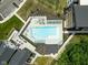 Aerial view of a community pool with lounge chairs and ample space for recreation and relaxation at 830 Freeland Way, Carmel, IN 46032