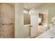 Bright bathroom features a tile shower, and neutral countertops at 8344 Leander Ave, Zionsville, IN 46077