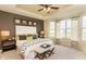 Beautiful bedroom with tray ceiling, natural light, and neutral furnishings at 8344 Leander Ave, Zionsville, IN 46077