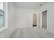 Bright bedroom with a closet, soft carpet and ample natural light from a large window at 8344 Leander Ave, Zionsville, IN 46077