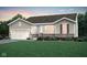 Charming single-story home featuring a landscaped front yard, attached garage, and welcoming entrance at 8344 Leander Ave, Zionsville, IN 46077