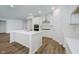 Bright kitchen features a large island, stainless steel appliances, and white cabinets at 8344 Leander Ave, Zionsville, IN 46077