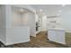 Open kitchen features a large island, stainless steel appliances, and white cabinets at 8344 Leander Ave, Zionsville, IN 46077