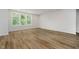 Bright living room with hardwood floors, large windows, and natural light, ideal for Gathering time at 8344 Leander Ave, Zionsville, IN 46077