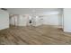 Spacious living area showcasing hardwood floors, open layout, and seamless transition to kitchen at 8344 Leander Ave, Zionsville, IN 46077