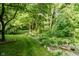 A tranquil backyard setting with lush greenery and a charming birdbath, creating a peaceful outdoor oasis at 9190 Hastings Trce, Indianapolis, IN 46234