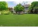 Expansive backyard features a lush lawn and mature trees, perfect for outdoor living and entertaining at 9190 Hastings Trce, Indianapolis, IN 46234