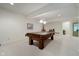 Spacious basement featuring a pool table and neutral carpeting with light paint and trim at 9190 Hastings Trce, Indianapolis, IN 46234