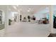 Open basement with white carpet, columns, and bright lighting; perfect for entertaining and relaxation at 9190 Hastings Trce, Indianapolis, IN 46234