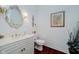 Charming half-bathroom with a decorative mirror, vanity and attractive accents at 9190 Hastings Trce, Indianapolis, IN 46234