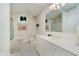 Bright bathroom with a white vanity, gold fixtures, and a neutral-toned shower at 9190 Hastings Trce, Indianapolis, IN 46234