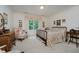 Cozy bedroom with warm light, floral accents, and a view of the outdoors at 9190 Hastings Trce, Indianapolis, IN 46234